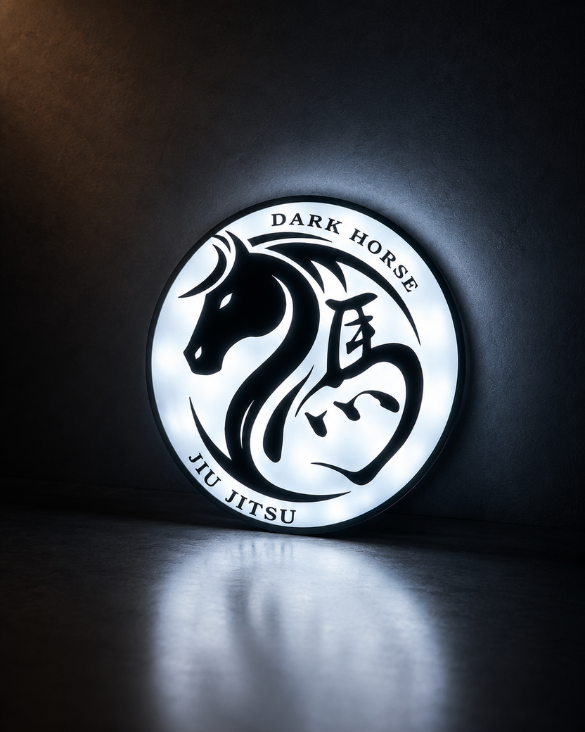 Illuminated Dark Horse logo sign