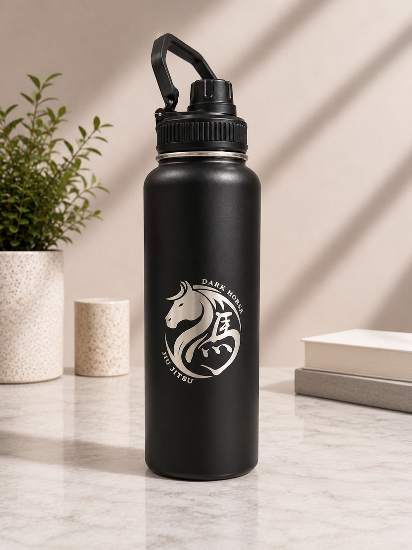 Black branded drink bottle engraved with the Dark Horse logo