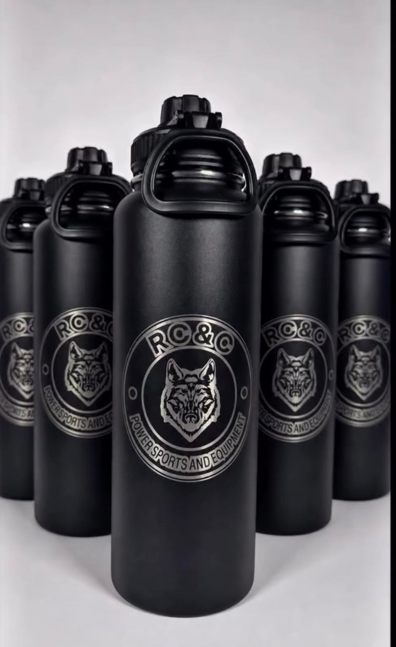 Batch of black bottles engraved with a business logo
